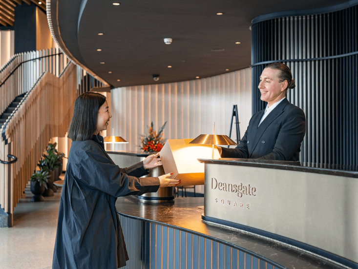 Concierge assisting a resident at Deansgate Square