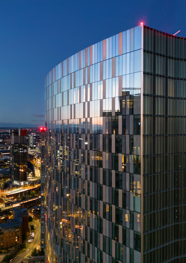 The Blade residential tower at dusk in Manchester