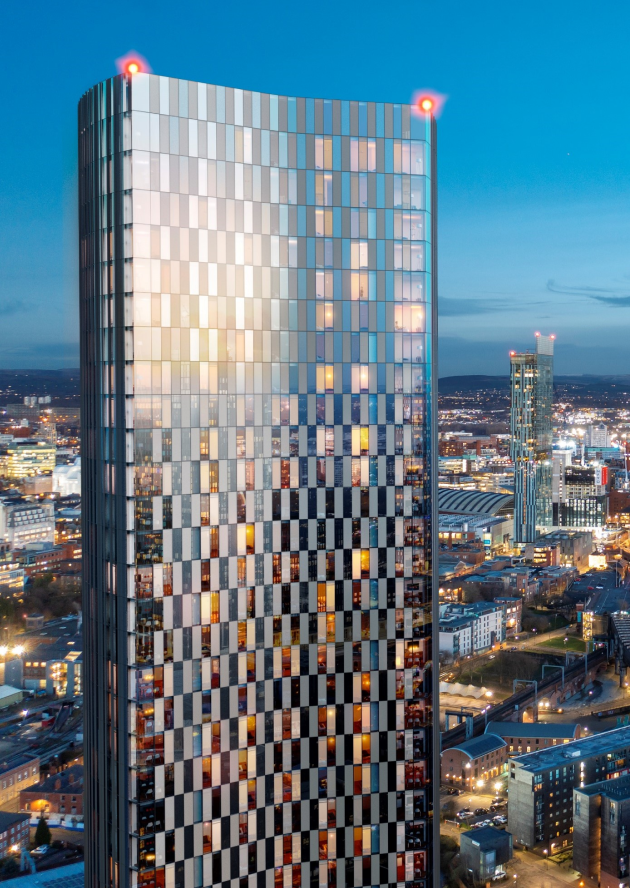 Vista River Gardens residential tower illuminated over Manchester